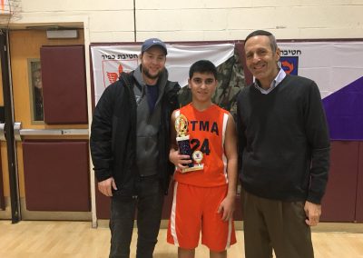 Judah Rhine with the 2018 Basketball champ from the Jewish Educational Center