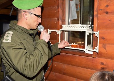 An IDF officer lights the Chanukah candles at our Warm Corner in Nokdim
